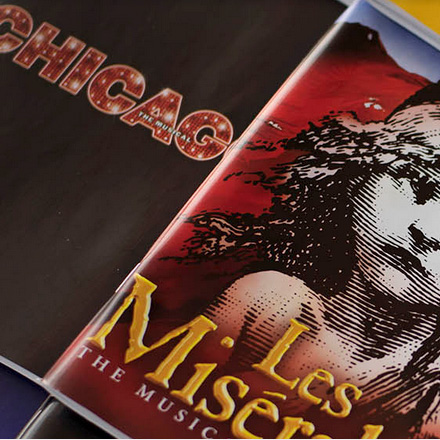 Picture of playbook covers for Chicago and Les Miserable