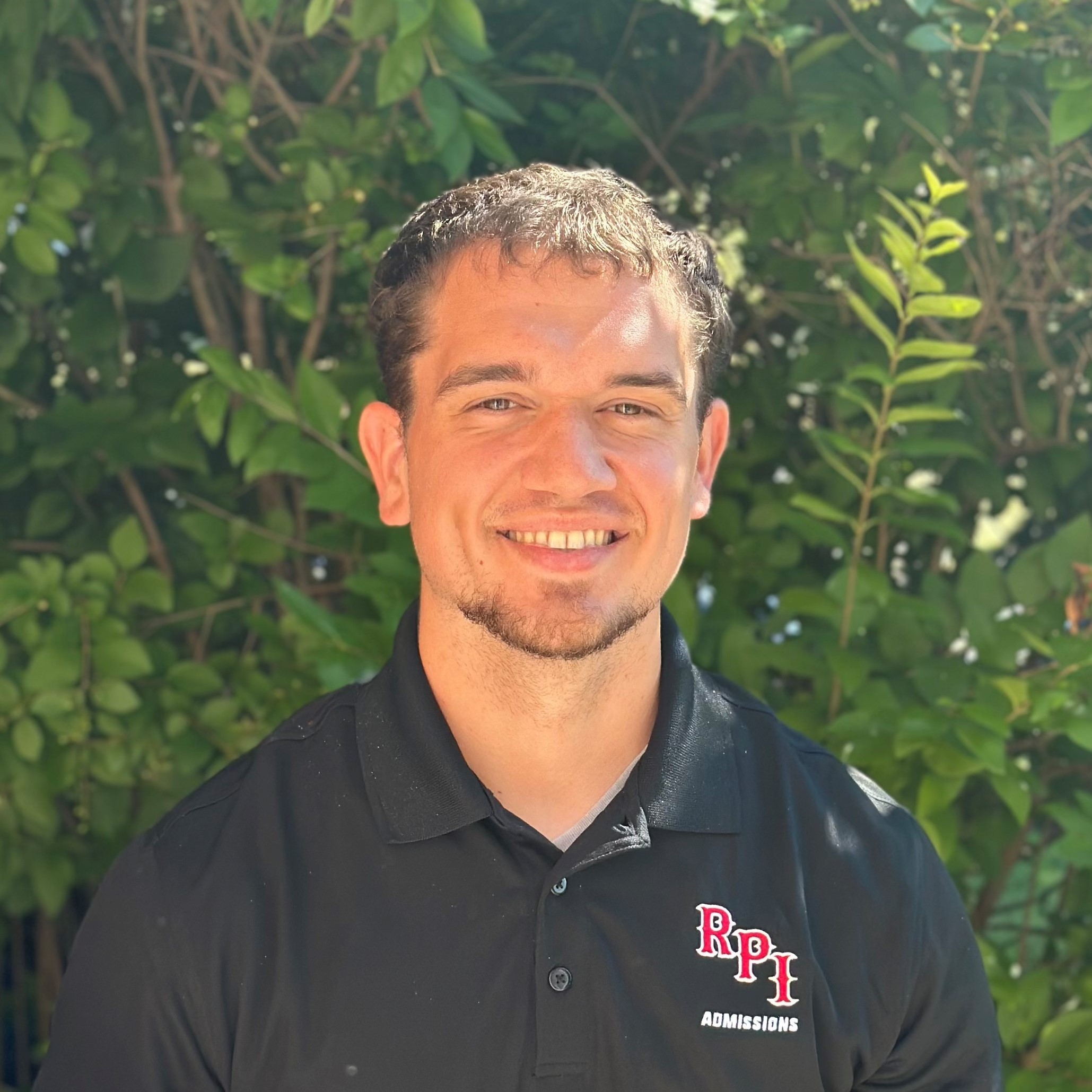 young man wearing black RPI polo