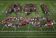 students standing in shape of RPI and infinity sign